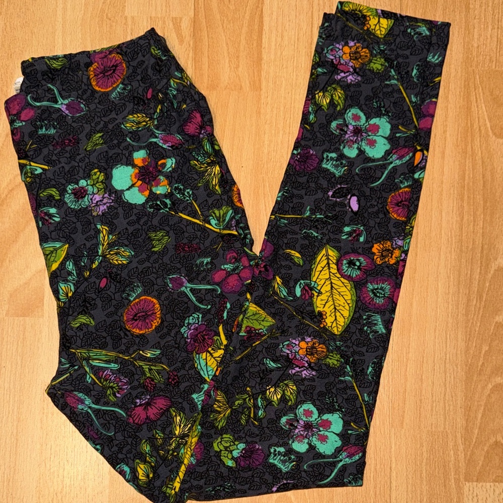 LuLaRoe Floral Patterned Leggings - Black, Purple, Green, Yellow, and Orange.